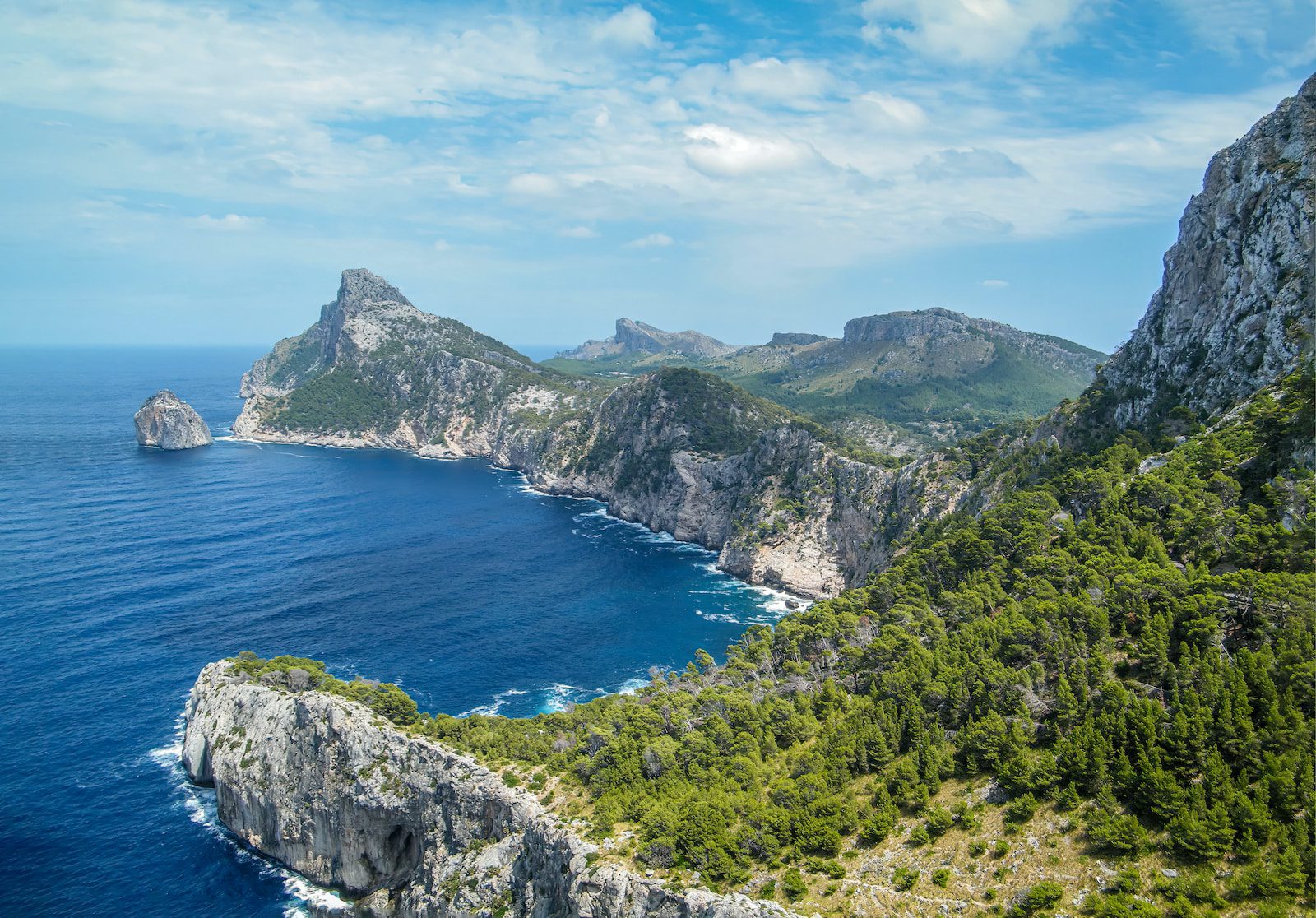 an aerial view of an island in the middle of the ocean